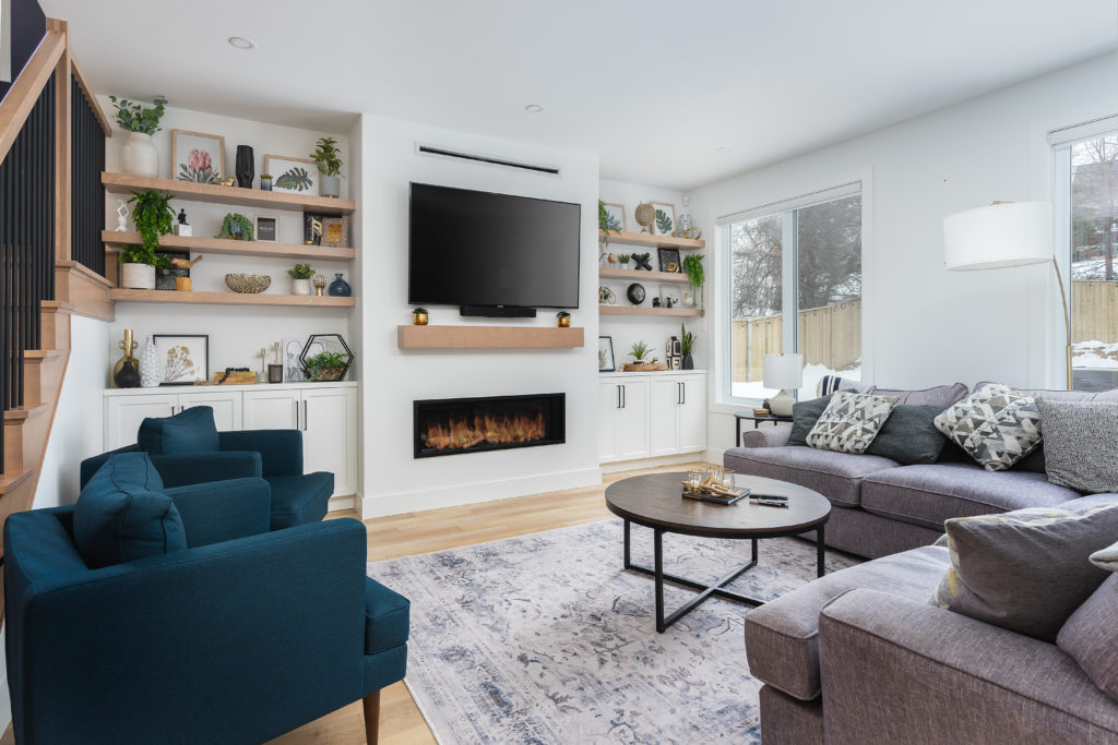 Custom built-in wooden shelving in the living room.