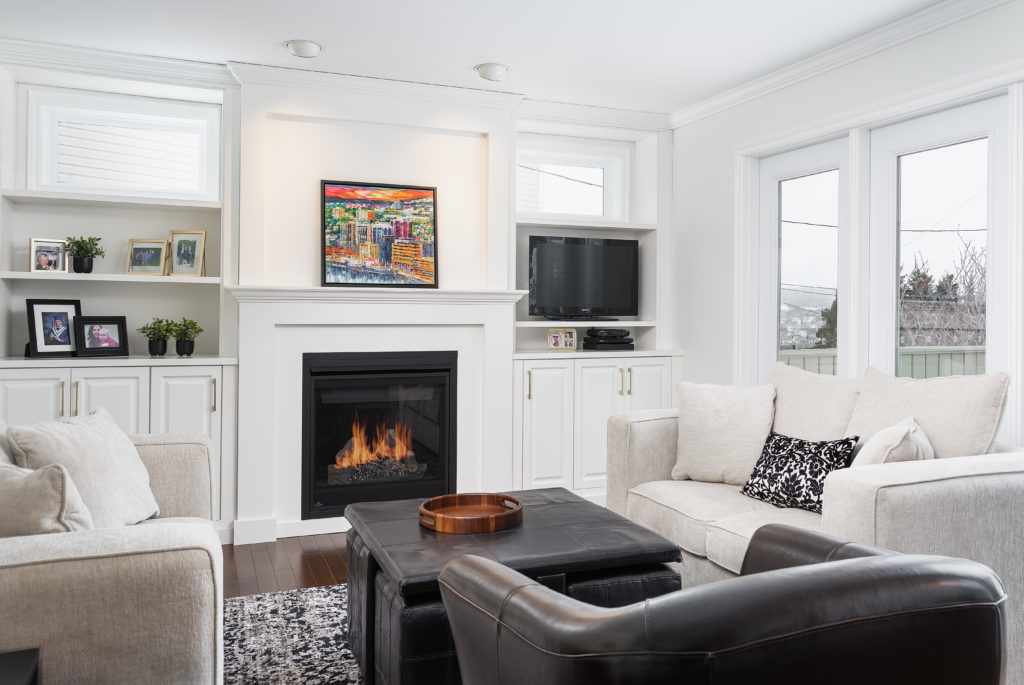 Traditional style white mantel over fireplace
