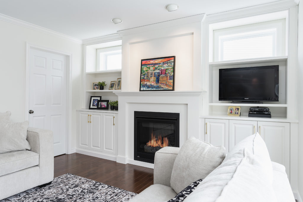 Traditional style white mantel over fireplace