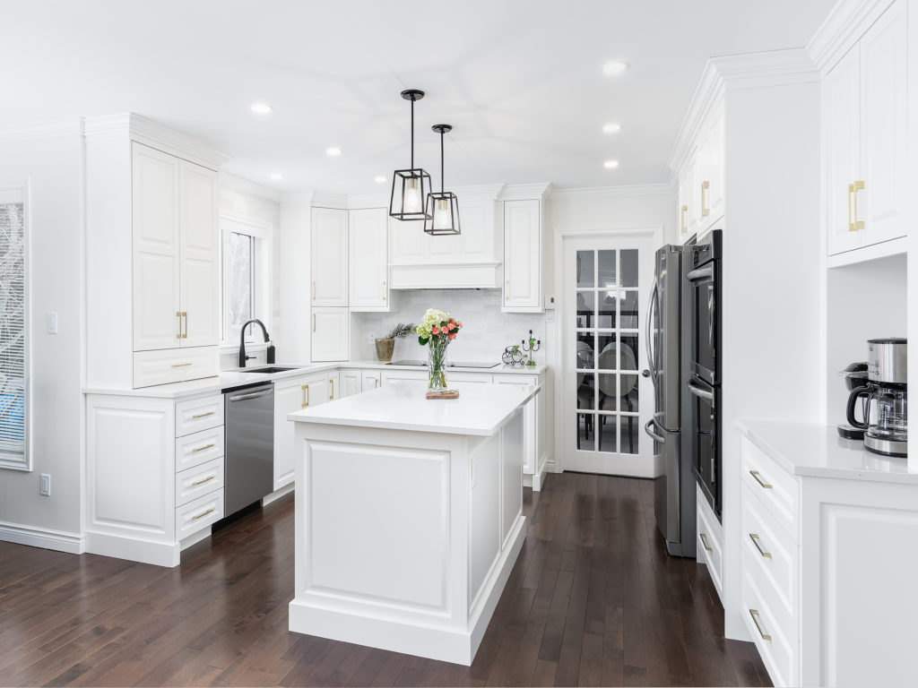 Traditional style kitchen with white cabinetry and gold hardware